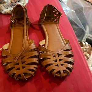 Brown sandal buckle to fasten or loosen used treated fair